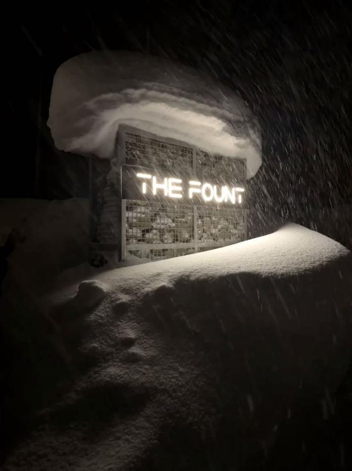 The Fount Niseko entrance in falling snow